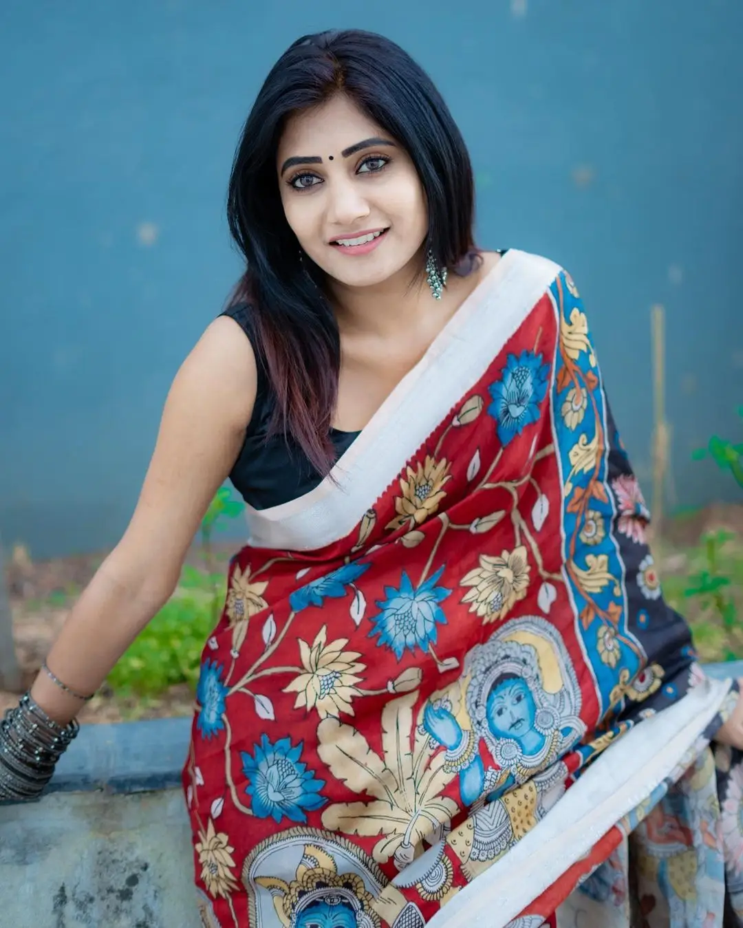 Vasanthi Krishnan Wearing Red Saree Blue Sleeveless Blouse